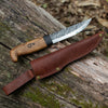 Handmade Bushcraft Knife 2.0 with a bent handle and texture on the metal